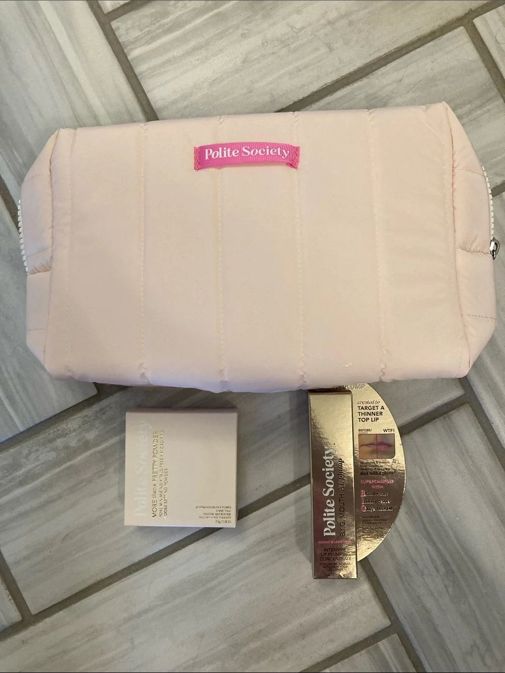 Polite Society lip plump, setting powder, and bag